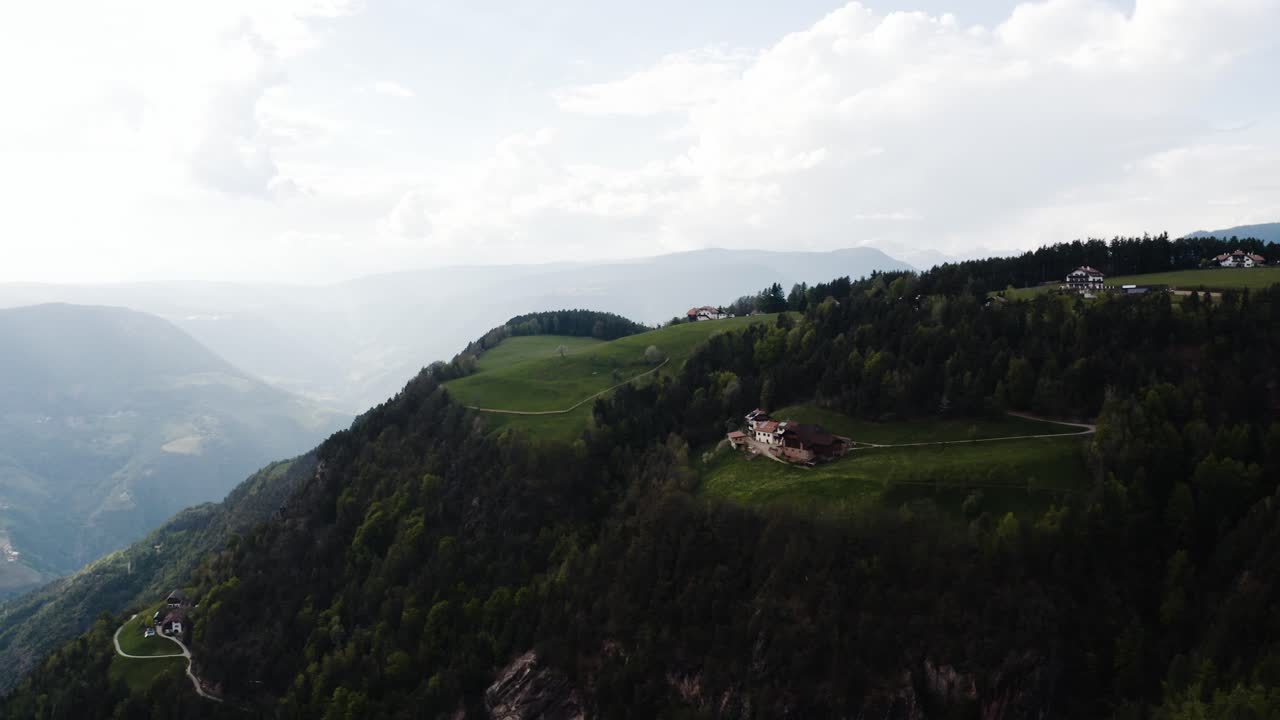 Drone shot of Italy's mountainous countryside in the Dolomites
