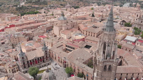 Aerial-view-spinning-around-Toledo-Cathedral,-Toledo,-Spain