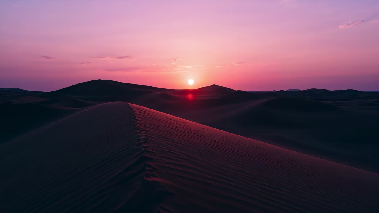 Shifting camera revealing prominent sand dune ridge in desert at twilight, sun backlighting ripples