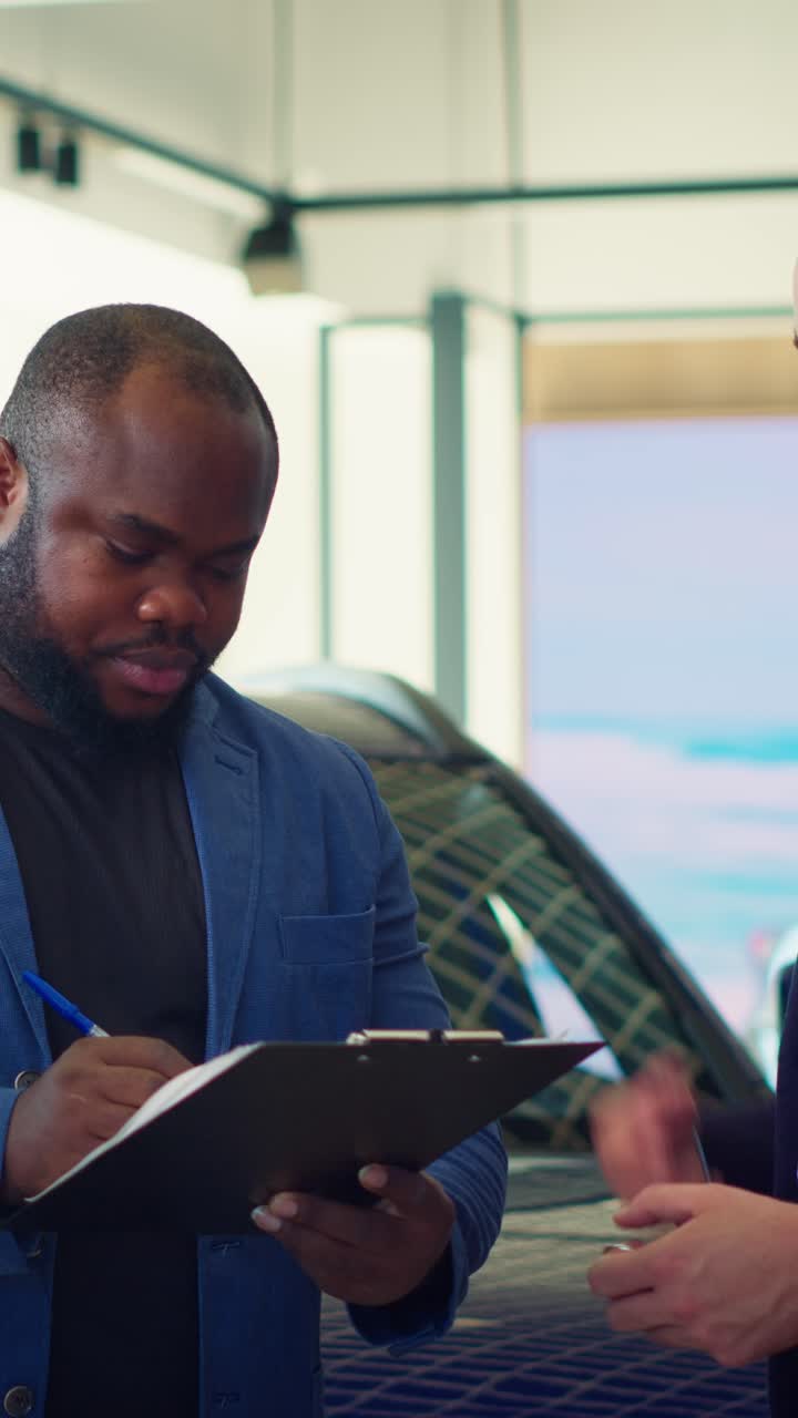 Customer Signs Car Purchase Agreement and Receives Keys at Dealership