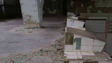 Slow-pull-out-shot-of-the-starting-blocks-at-the-long-abandoned-swimming-pool-in-Prypiat