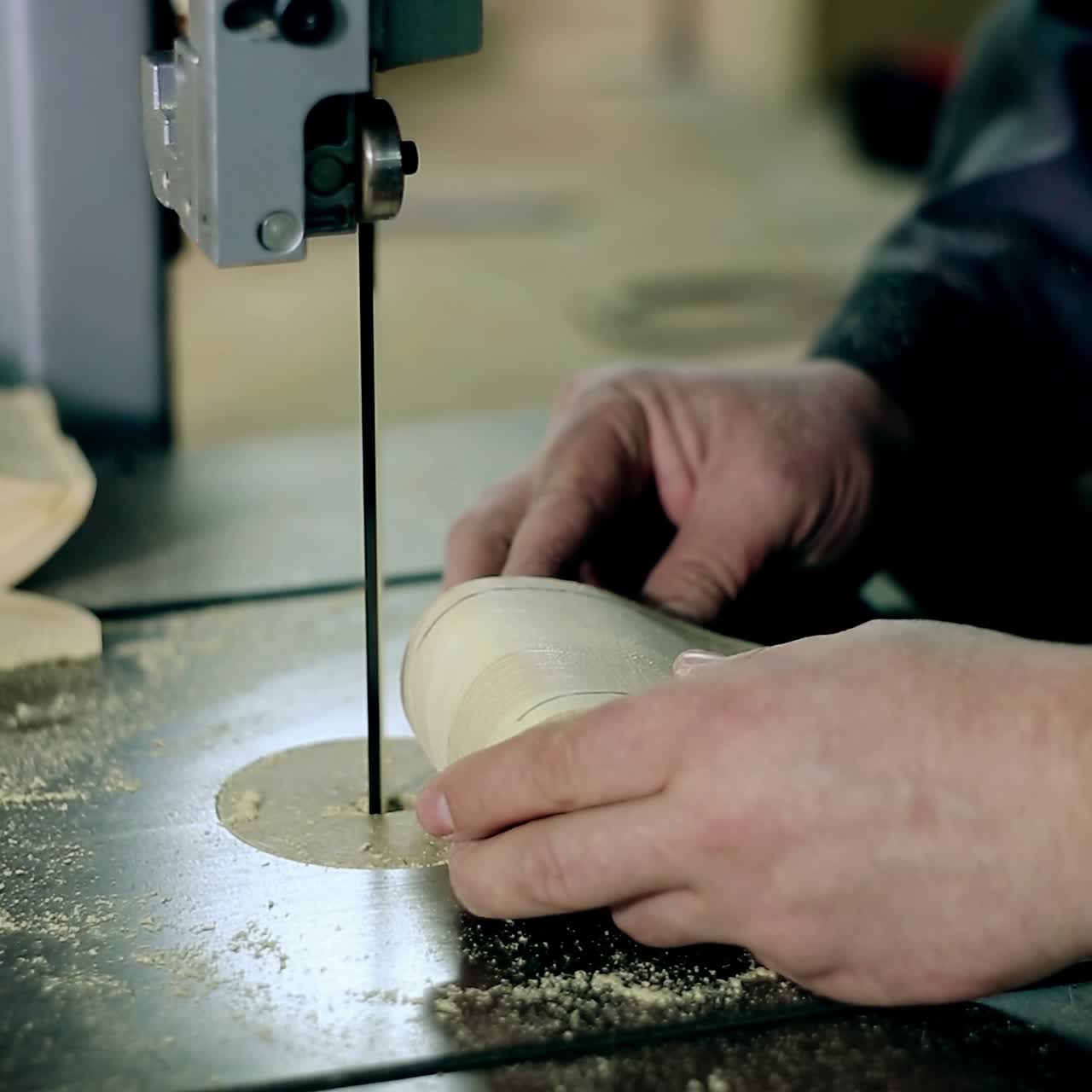 Man Cutting Wood Plank