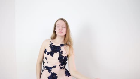 slow motion dance performance of an attractive young caucasian dancer indoors