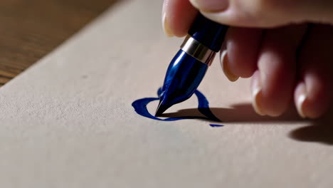Hand Writing a Heart with a Pen