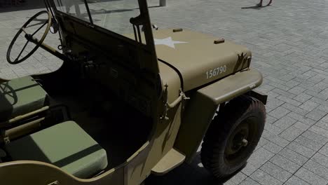 us army jeep military vehicle on display from rear side - khaki left hand drive