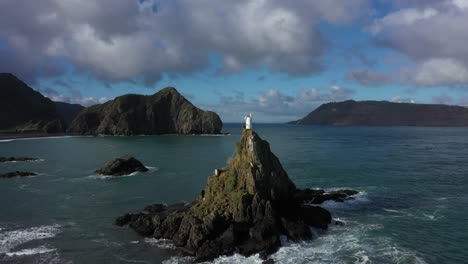 Scenic-Whatipu-Lighthouse-near-Huia-beach,-Auckland,-New-Zealand,-aerial-shot