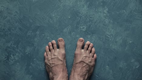 legs close-up. large veins. tense, tired legs. contrast image. top view men's feet