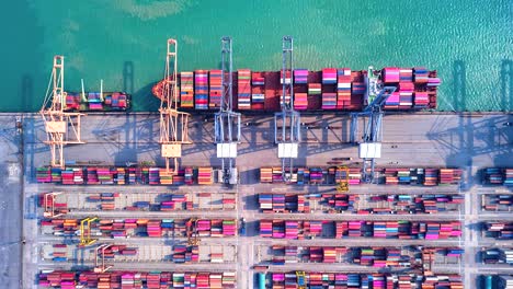 top view time lapse unloading goods from the ship in industrial port with container port where is a part of shipping