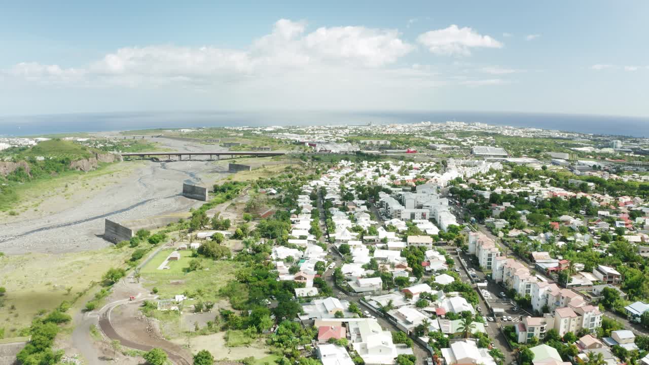 Moving done view of Saint Denis city in Reunion Island, France during afternoon
