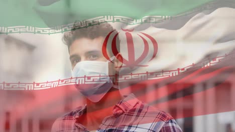 animación de la bandera de irán ondeando sobre un hombre que usa una máscara facial durante la pandemia de covid-19