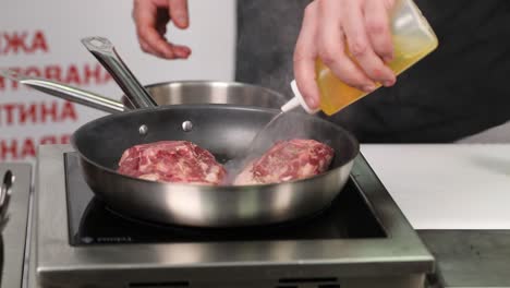 cooking steak in a pan