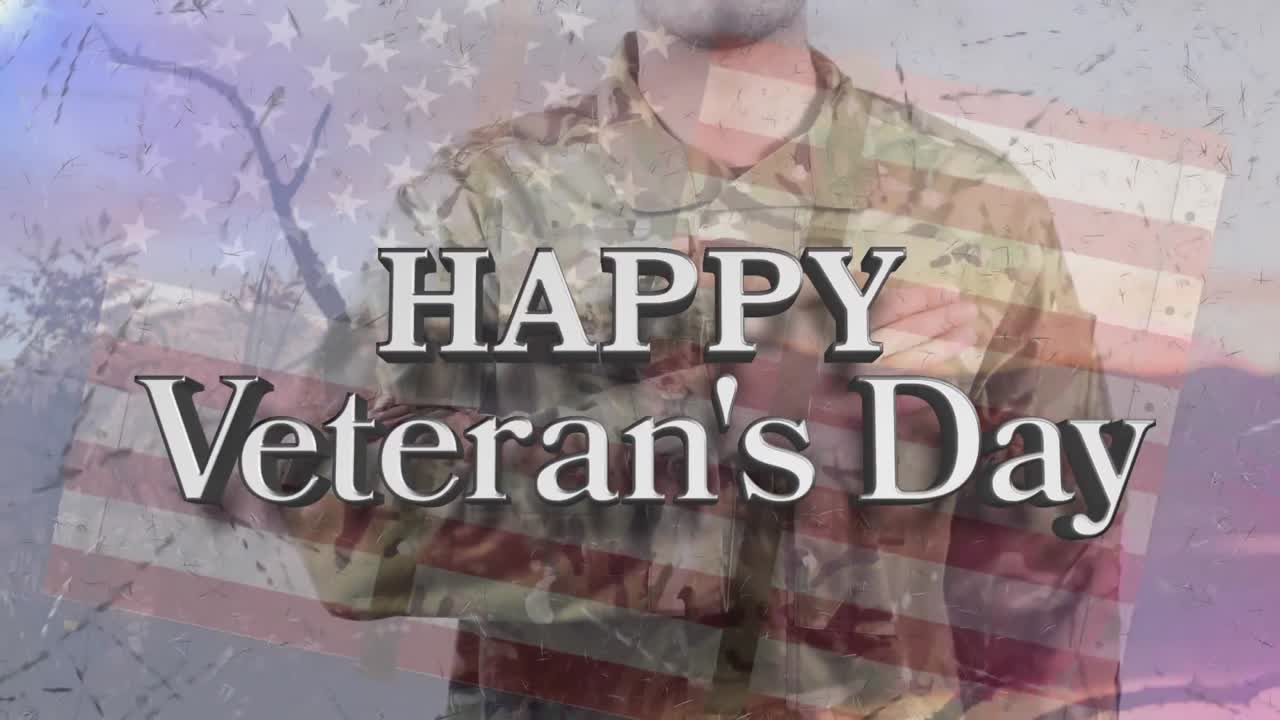 Animation of happy veteran's day text over caucasian male soldier and american flag
