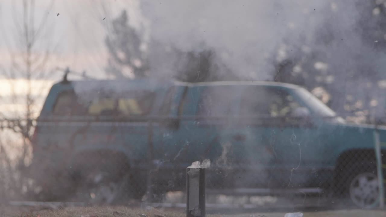 A Christmas ginger bread and graham cracker decoration has a large fire cracker or M 80 lit below it as it burns if finally explodes in slow motion!