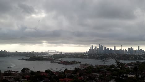 overcast skyline view of a metropolitan city with iconic bridge and tower: a blend of urban architecture and gloomy weather