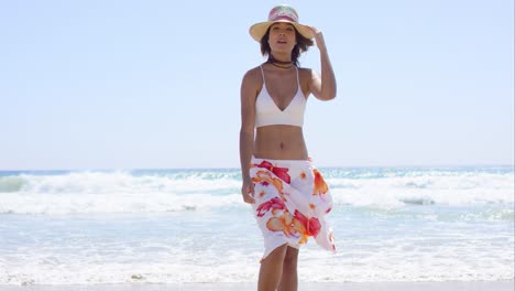 Sexy-young-woman-posing-on-a-tropical-beach