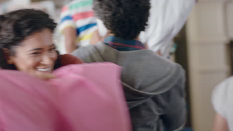 happy-family-having-pillow-fight-mother-and-father-enjoying-playing-with-children-at-home-having-fun-together-on-weekend