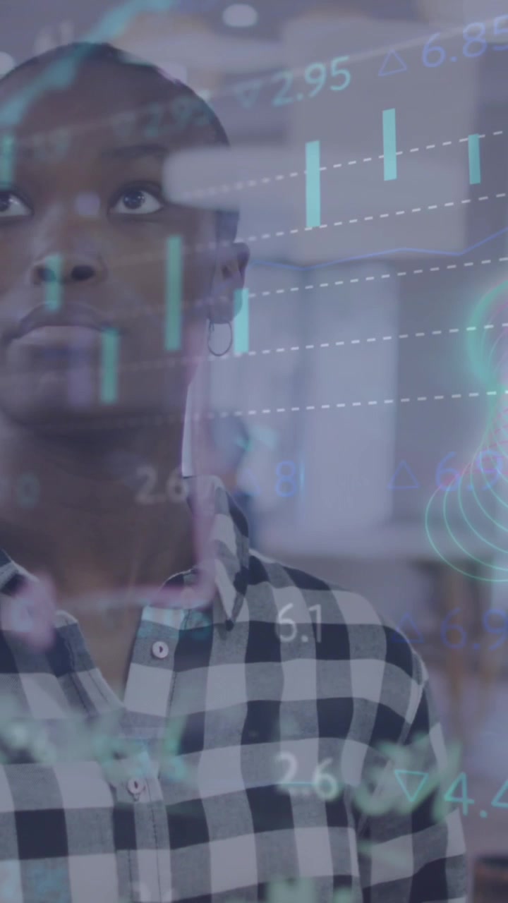 A black woman and her colleagues discussing financial matters in a corporate office setting