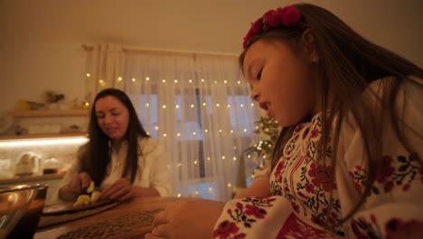 mother and daughter preparing for christmas celebration