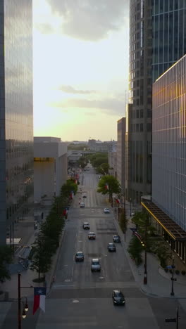 vertical drone shot over the texas avenue in middle of buildings in houston