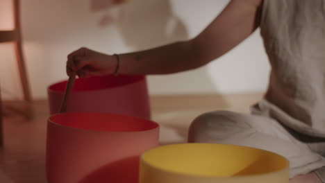Woman Playing Singing Bowls for Sound Healing