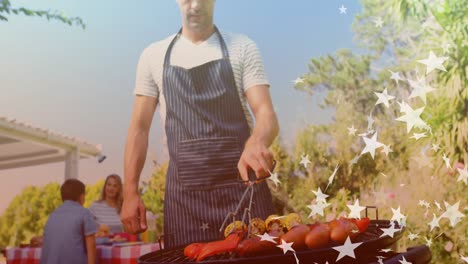 animation of stars over group of caucasian friends having bbq and talking