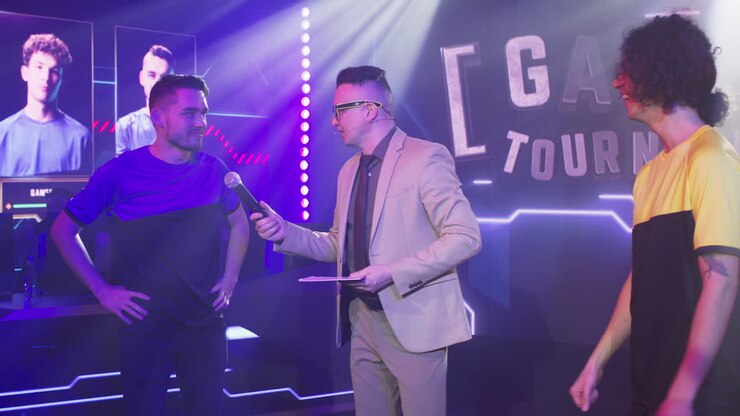 male Announcer Interviewing Team Leaders during Esports Competition Adult Man Host with Microphone Asking Questions to Young Esportsman Male Gamers at Start of Professional Gaming Tournament