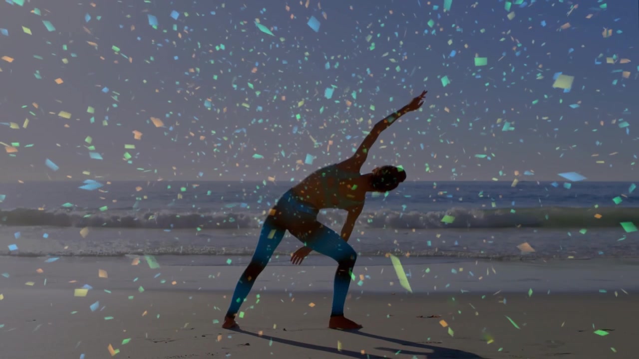 Planting feet woman in blue leaning into side bend on beach, balancing, red shoes, confetti overlay