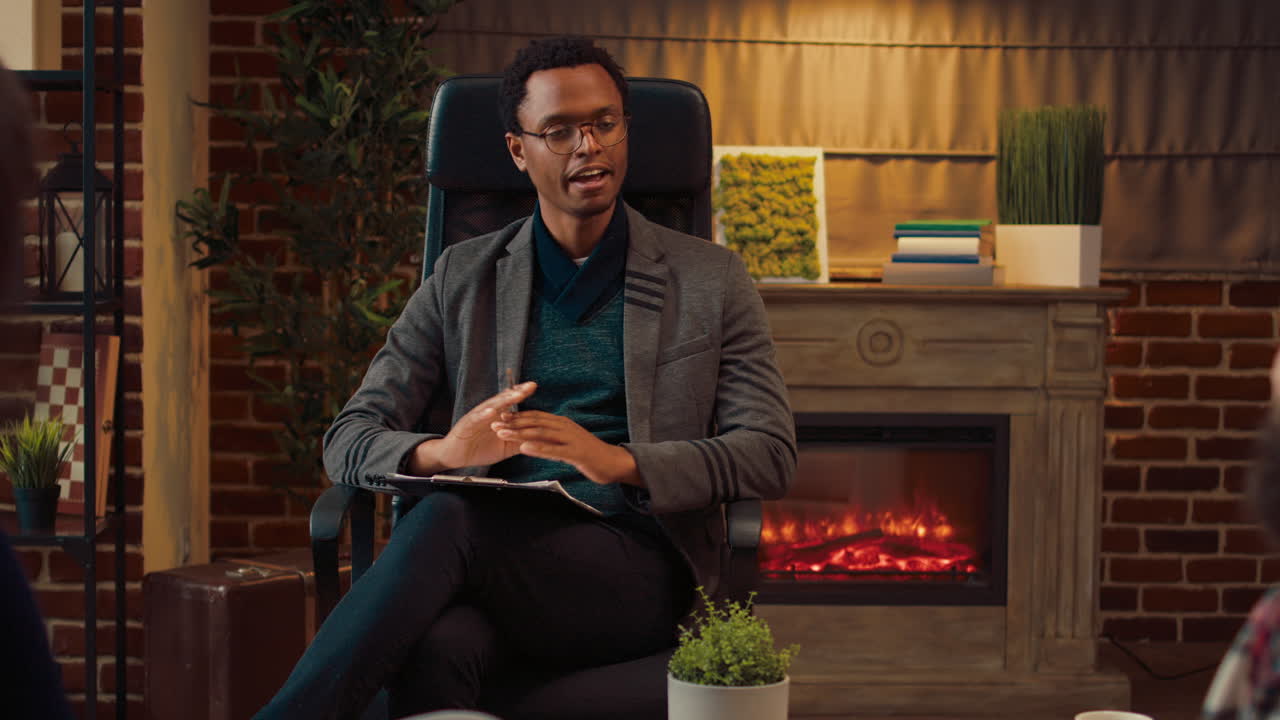 African american psychologist listening to married people