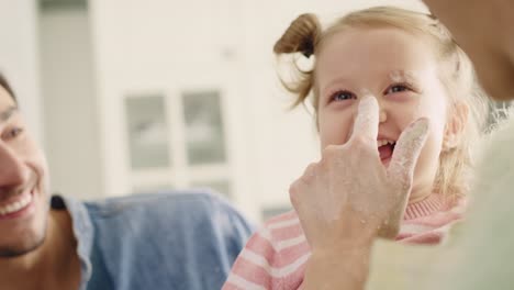 Handheld-view-of-happy-family-spending-time-in-the-kitchen