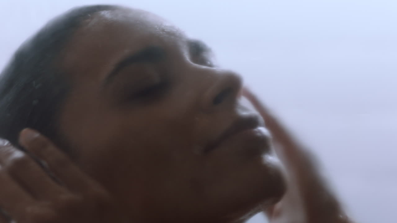 beautiful woman taking shower touching wet skin enjoying luxury spa cleansing smooth complexion