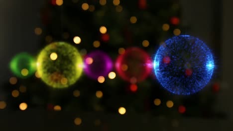 animation of multicoloured christmas baubles decorations on black background