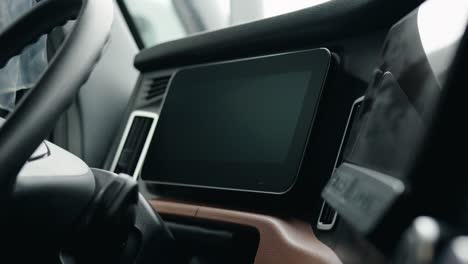 Semi-Truck-Driver-peeling-screen-protection-off-the-dasboard-from-a-new-freightliner-cascadia-volvo-2023