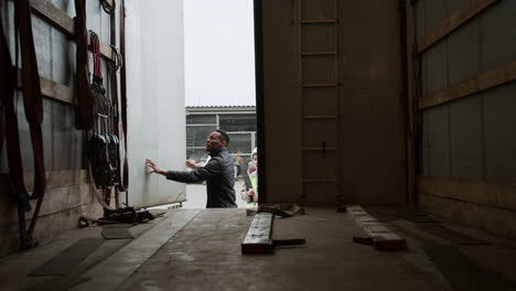 manager and truck driver checking truck