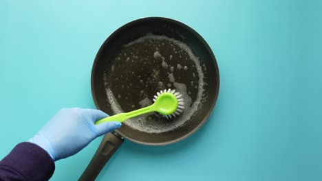 cleaning a dirty pan