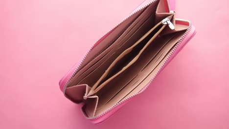 empty pink zip wallet