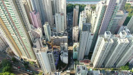 Mega-residential-buildings-and-traffic-in-downtown-Hong-Kong,-Aerial-view