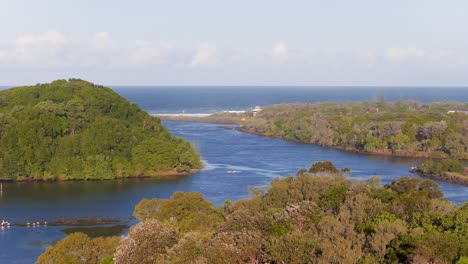 aerial footage captures a serene river winding through lush islands under clear skies, highlighting natural beauty and tranquility