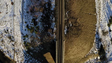 flying directly obove railway during winter