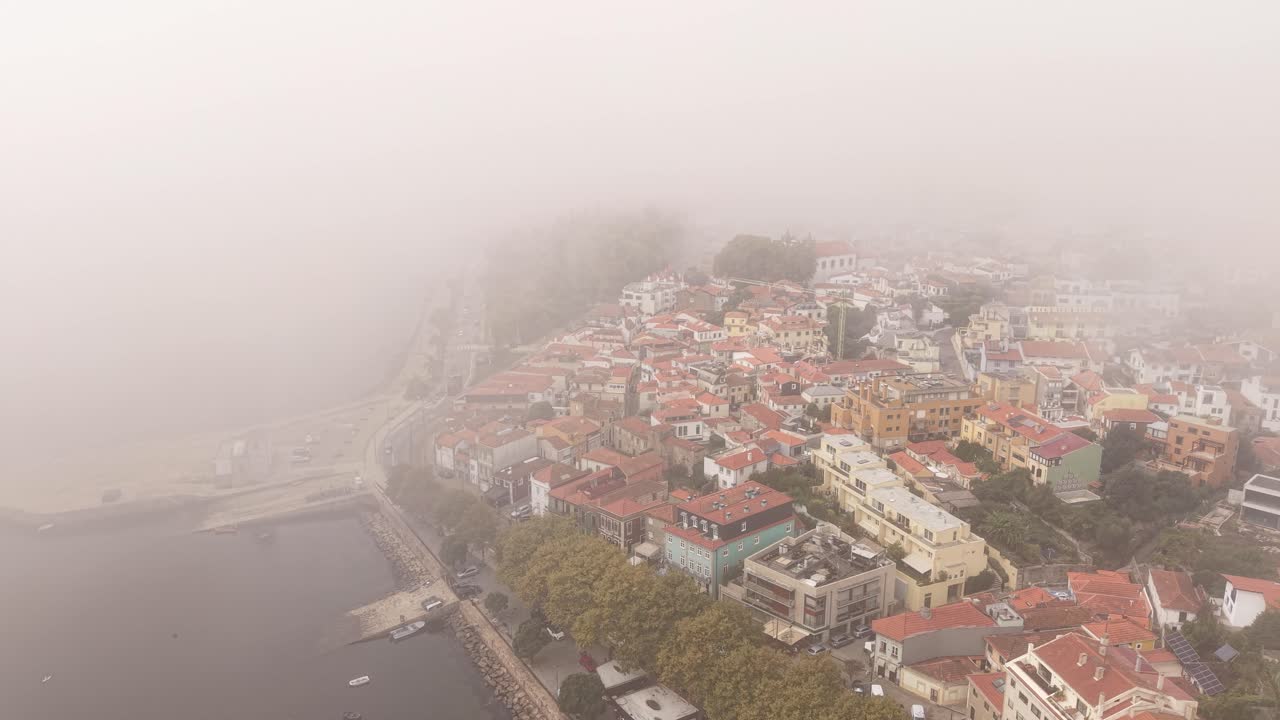 Porto, Portugal. Drone Shot of Dense Fog Above River Beat Atlantic Ocean and Residential Neighborhood