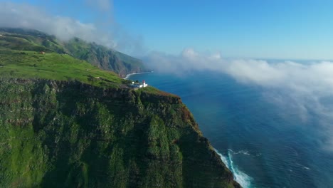 Serene-clouds-and-blue-waters-closing-in-on-Ponta-do-Pargo-Lighthouse