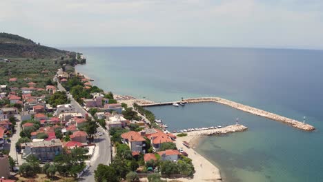 aerial decending shot of skala sotiros resort on thassos island, greece