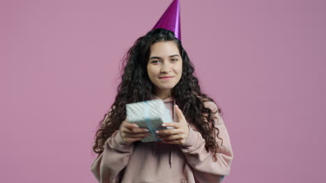 woman with gift box and party hat