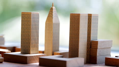 set of model wooden tower blocks arranged on a table