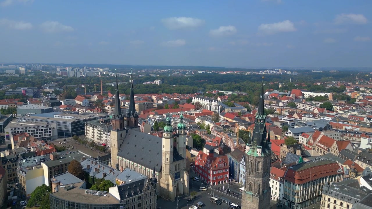 market square with the red tower and st. Mary's church in halle saale, germany. Nice aerial view flight fly reverse drone