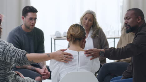 Woman-crying-and-being-comforted-during-group