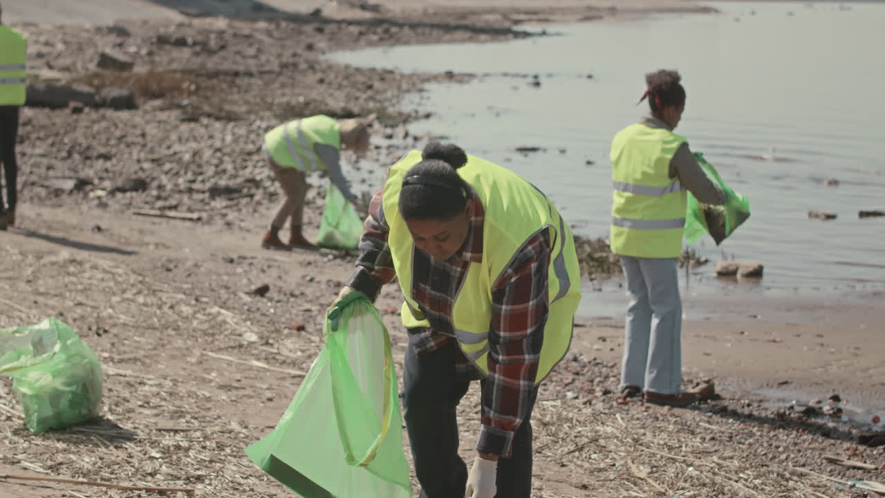 Environmental Volunteers Doing Coastal Cleanup