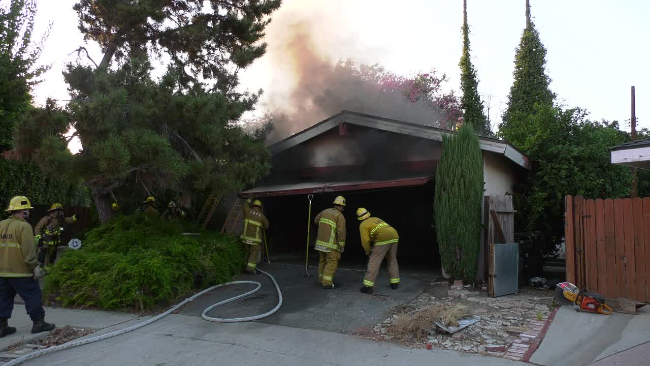 Firefighters Battle Residential Garage Fire