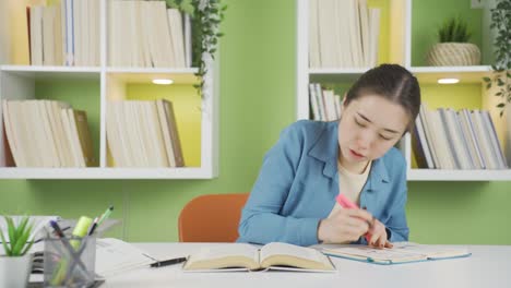 asian teenage schoolgirl serious and focused.