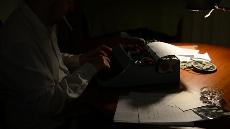 A journalist writing on an old typewriter