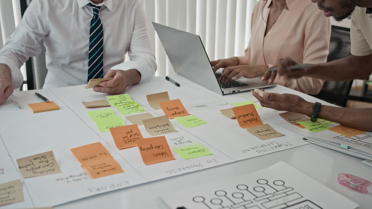 Time Lapse of Unrecognizable Managers Working on Project at Table